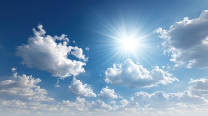 Bright sun shines in a deep blue sky filled with fluffy white cumulus clouds on a clear day