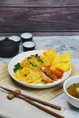Egg noodle soup with red roasted pork and pork wontons Chinese food