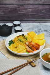 Egg noodle soup with red roasted pork and pork wontons Chinese food