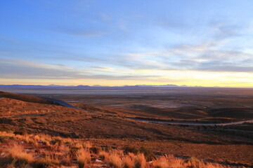 sunset view to the Salar de Uyuni Salt Flats in Bolivia from a viewpoint near the town Uyuni