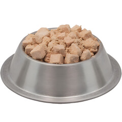 Close up of a metal bowl filled with freeze dried dog food cubes on a black background
