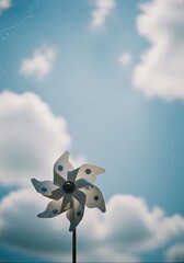 Pinwheel Against a Cloudy Blue Sky