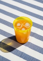 Iced Orange Drink on Striped Surface