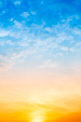Sky,Beautiful sunset view, luxury soft gradient orange gold clouds and sunlight on the blue dramatic sky perfect for the background, morning, evening,Twilight, climate change,Vertical sunset photo