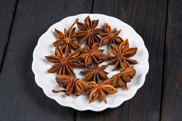 Star anise spice in white plate