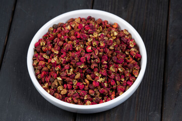 Spicy red peppercorns in a bowl