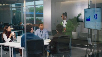 Confident CEO leads diverse startup tech team in night office meeting, brainstorming strategy, coding ideas, business growth, and software development with programmers and professionals collaborating - Powered by Adobe