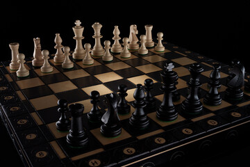 Chessboard with classic wooden pieces – game setup
