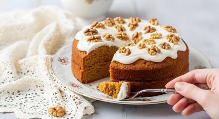 Cutting a slice of creamy carrot cake