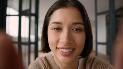 Point of view POV webcam woman female Hispanic Caucasian girl using mobile phone device touchscreen...