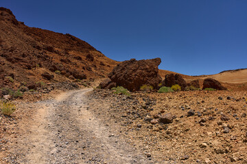 Curved trail through volcanic terrain