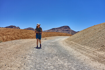 Hiker on volcanic trail