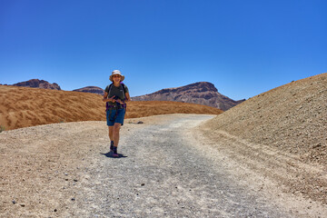 Hiker on volcanic trail