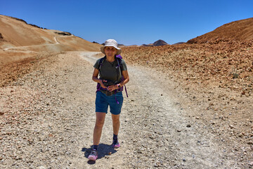 Hiker on volcanic trail