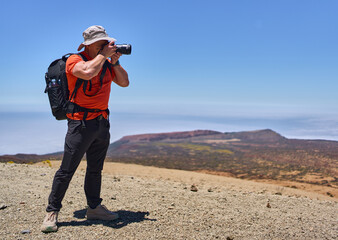 Hiker with camera on Teide
