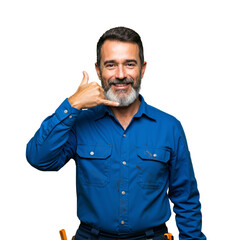 Smiling Middle-Aged Man Signaling Phone Gesture, Wearing Blue Shirt and Tools, Isolated on Black Background