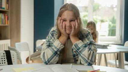Stressed tired Caucasian teen girl teenager student schoolgirl exhausted sad child kid pupil...
