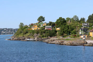 Naklejka premium Cottages on an island