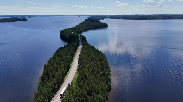 Tracking shot of a truck in Pulkkilanharju, P&auml;ij&auml;nne National Park in Finland