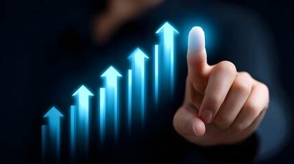 Finger pointing at a digital graph showing business growth and progress.