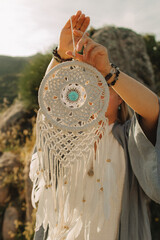 Close-up of female hands holding natural healing stones. Tools for energy balance, emotional...