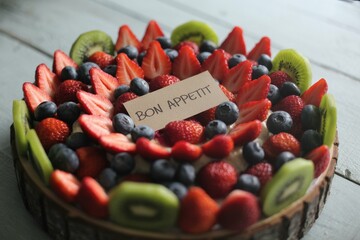 A photograph of a vibrant, circular food frame filled with colorful ingredients arranged in an artistic pattern