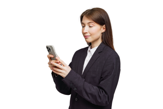 Professional woman engaged in mobile device activity, exuding confidence in a stylish business suit at a bright location