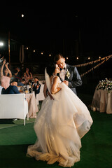 first dance of the bride and groom inside a restaurant
