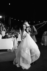 first dance of the bride and groom inside a restaurant