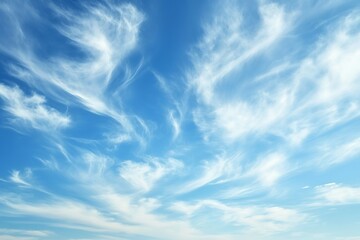 Clear blue sky with wispy cirrus clouds creating a dreamy, peaceful, and uplifting atmosphere for nature, travel, and freedom concepts