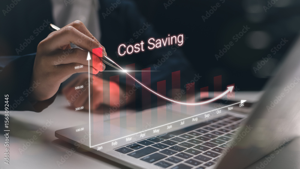 Poster a businessman using a pen to indicate a rapid cost-saving strategy with a digital graph on a laptop.