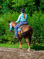 Cowgirl on horseback during an outdoor race