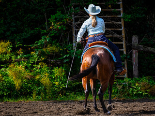 Cowgirl on horseback during an outdoor race