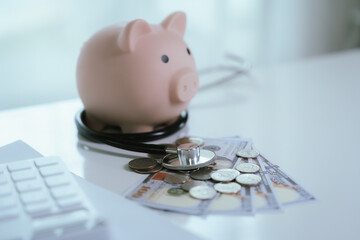 A doctor is performing a financial health check, using a stethoscope and a piggy bank to represent...