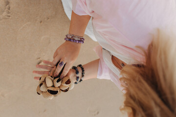 Close-up of female hands holding sound healing instruments. Tools for therapy, inner balance, and...