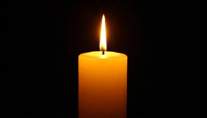 Burning candle on a black background 