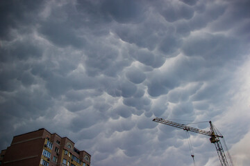 Big blue round clouds in a cloudy sky