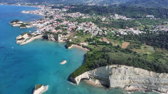 4k aerial video footage flying along Sidari coastline in north part of Corfu Island with amazing bays, Sidari cityscape and famous Apotripiti Beach, Kanali tou Erota and sandstone cliffs 