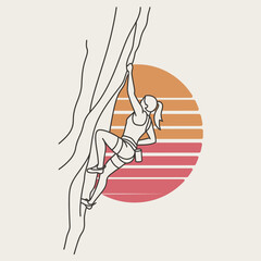 Woman rock climbing against a sunset