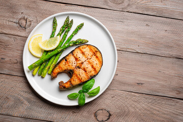 Grilled salmon steak with roasted green asparagus