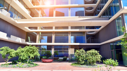 City life, urban landscape and ecology.  Modern office complex with glass facades and smooth lines...