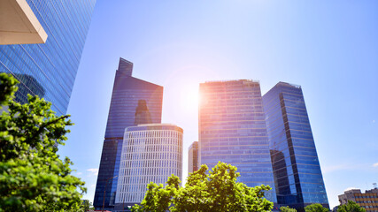 City life, urban landscape and ecology.  Modern office complex with glass facades and smooth lines...