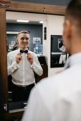 portrait of a young guy groom at the training camp in the barbershop