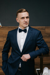 portrait of a young guy groom at the training camp in the barbershop
