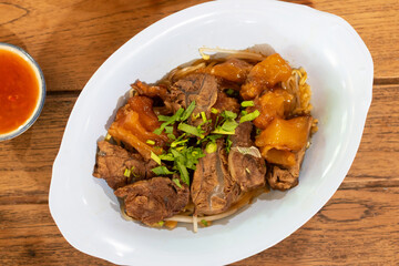 A delicious plate of tender meat garnished with fresh herbs, ready to be enjoyed. Perfect for culinary enthusiasts and food lovers.