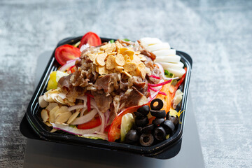 Salad with meat in a bowl