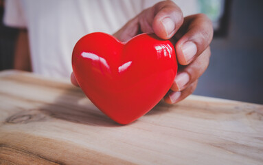 Hand holding red heart, World health day, Health care and mental health concept, Health insurance, Charity volunteer donation, CSR responsibility, World heart day, Self love