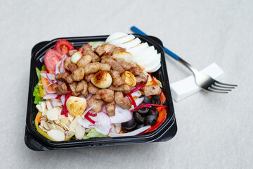 Salad with meat in a bowl