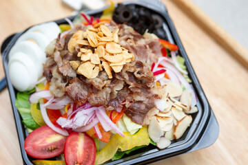 Salad with meat in a bowl
