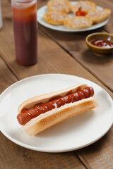 Hot Dog With Ketchup On White Plate Table